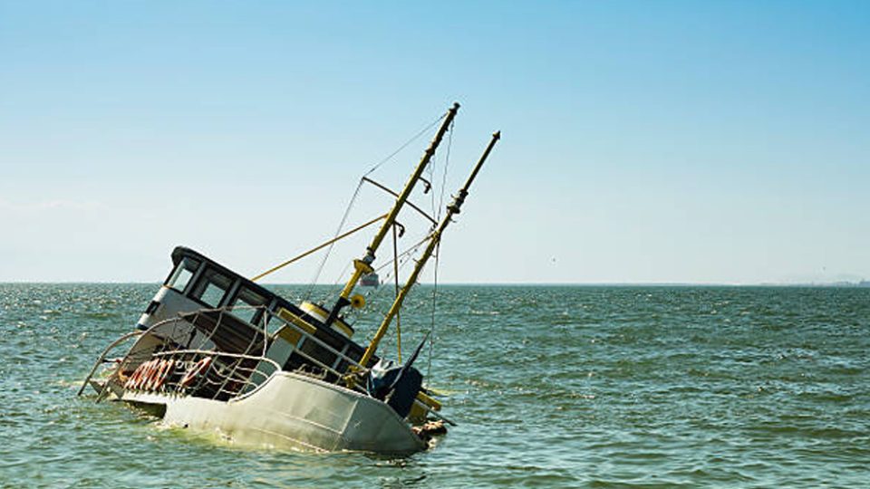 Boat sinking at sea